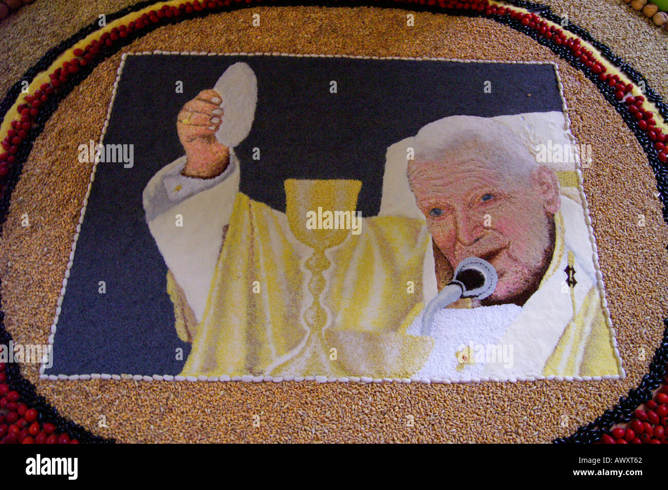 Pope Benedict Ratzinger blessing, painting made of seed and colourful sand Stock Photo