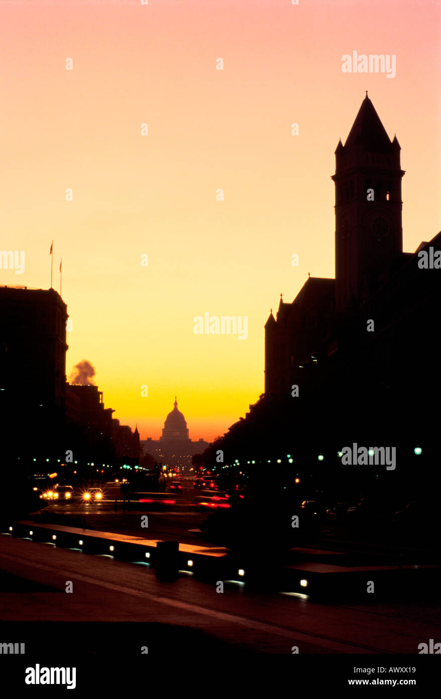 Washington, D.C., USA, Pennsylvania Avenue at dawn, Old Post Office Building on right, U.S. Capitol building in distance Stock Photo