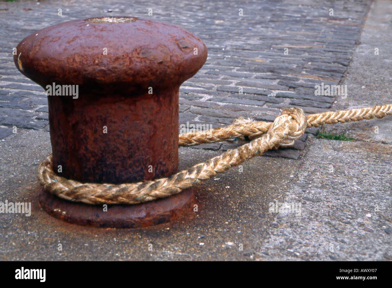 Bollard and mooring rope, Cleggan harbour, Connemara, Ireland Stock