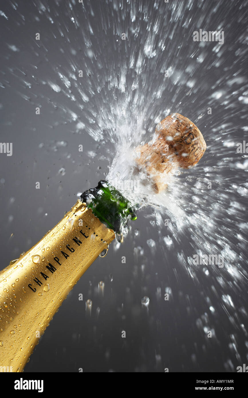 Champagne bottle popping cork, close-up Stock Photo