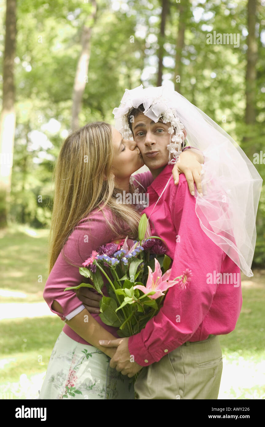 Husband wearing wedding veil Stock Photo