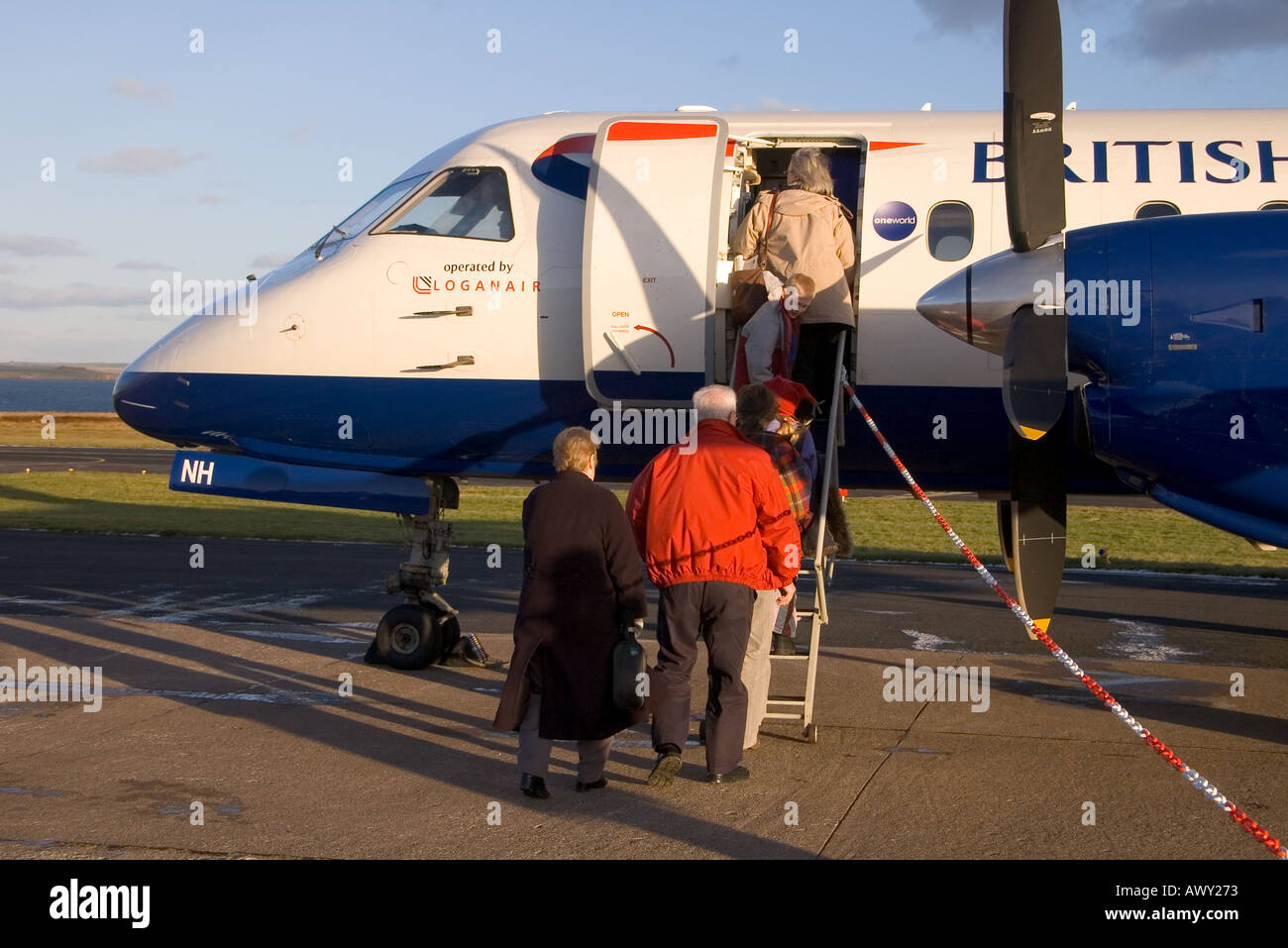 dh british airways plane KIRKWALL AIRPORT ORKNEY Airplane Passengers boarding BA aeroplane Saab 340 Stock Photo