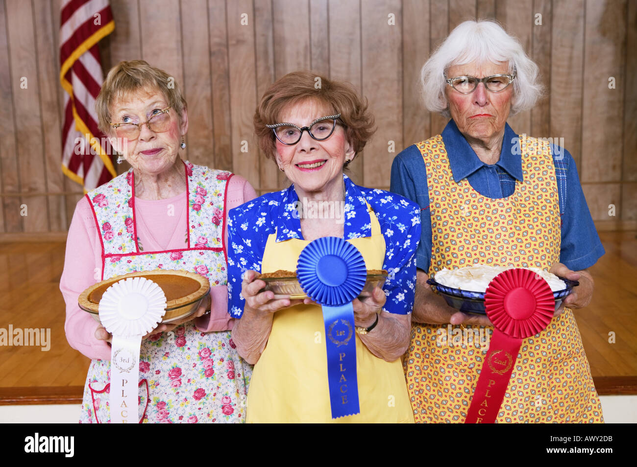 Three women with prizes for homemade pies Stock Photo
