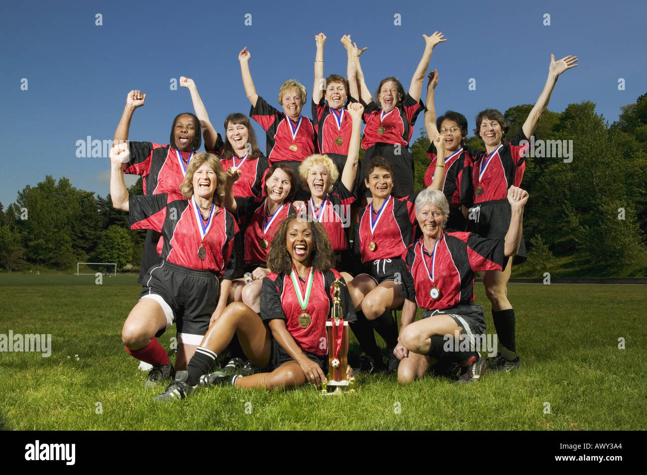 Female soccer team celebrating Stock Photo