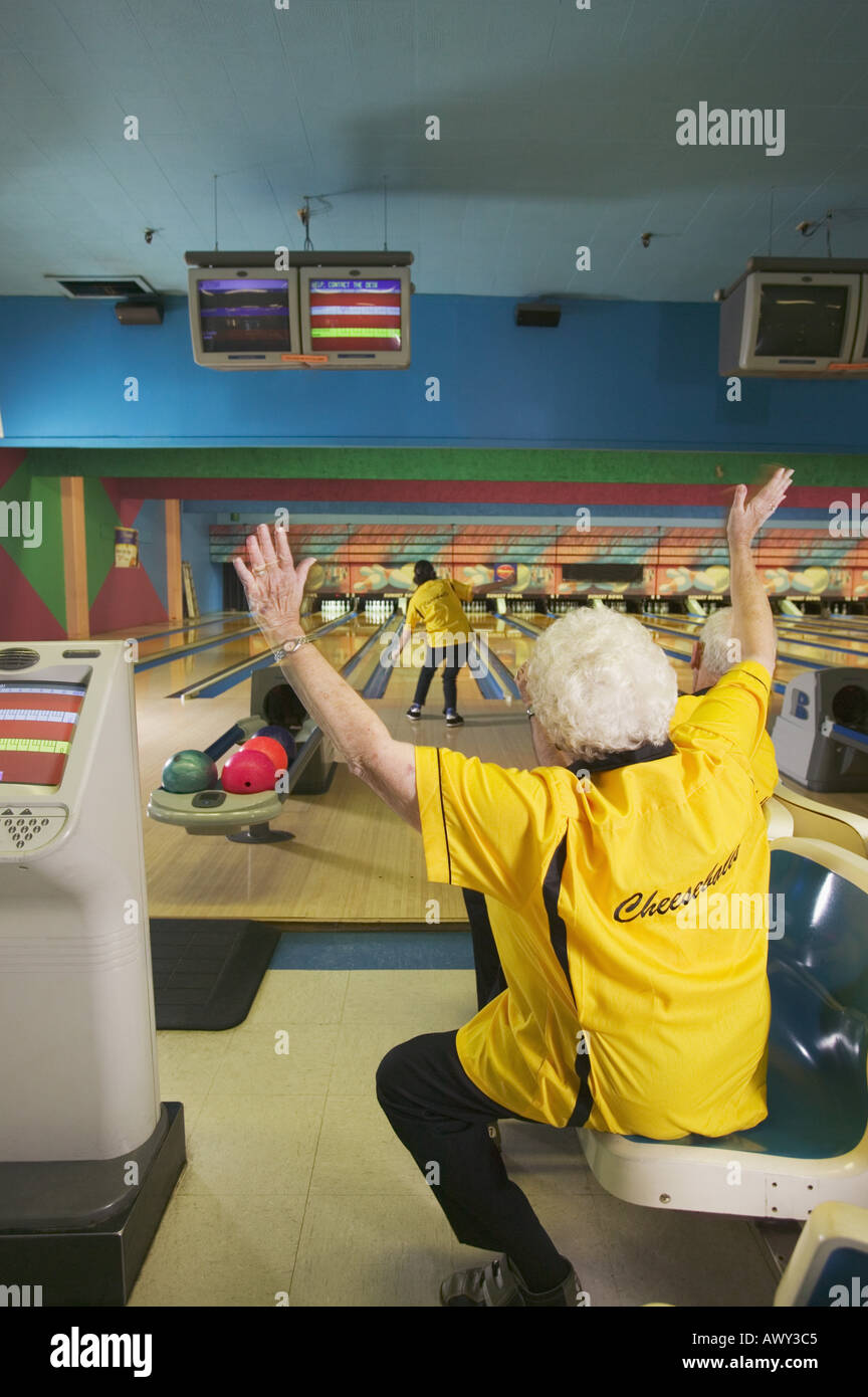 Female bowler cheering for her teammate Stock Photo