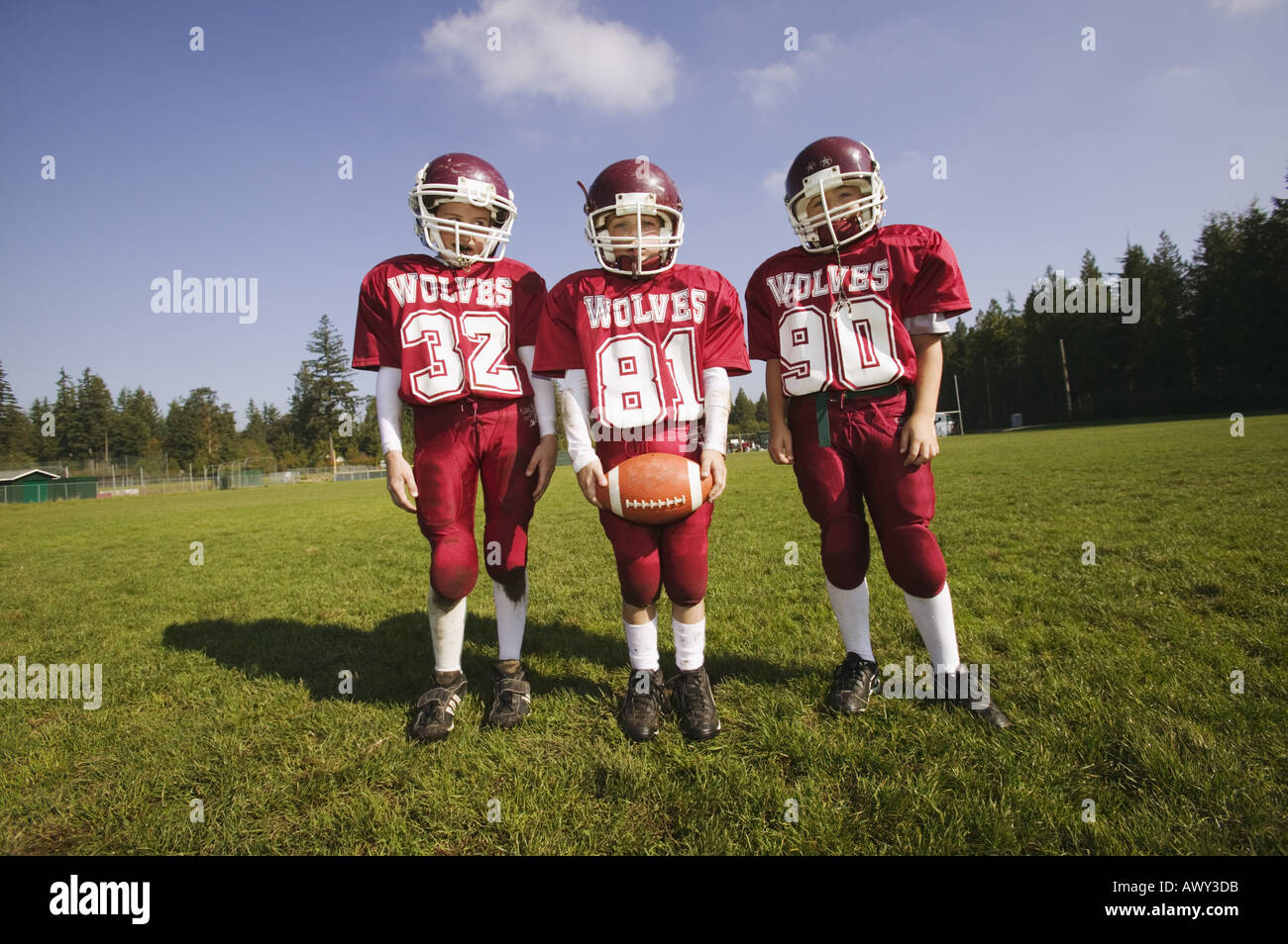 Group of three young football players Stock Photo