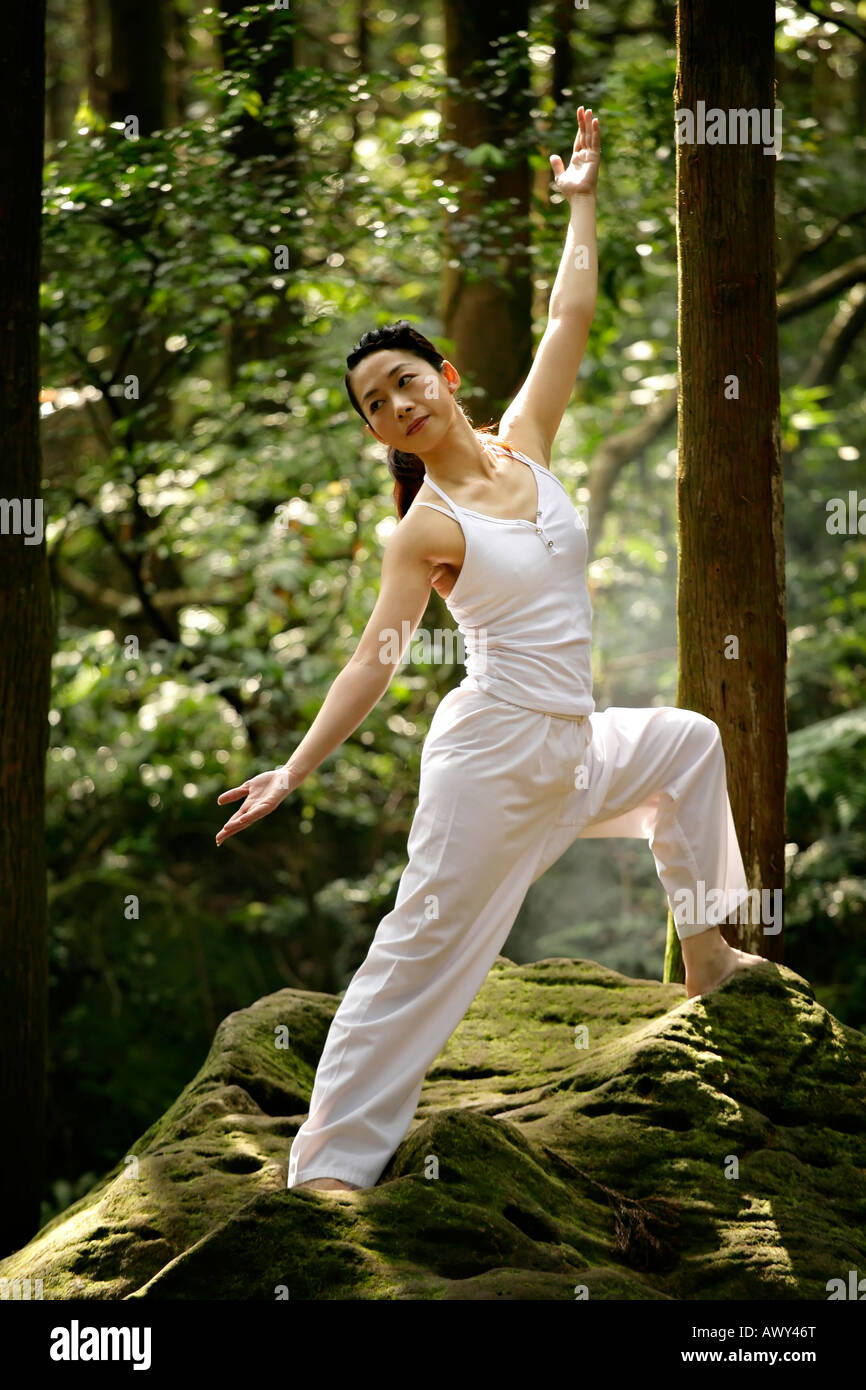young woman practice yoga in forest Stock Photo - Alamy