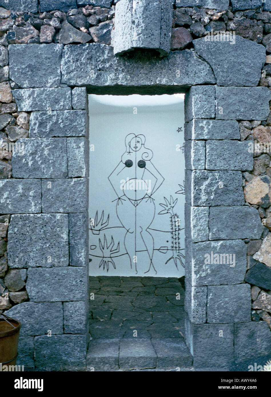 The woman cartoon executed by Cesar Manrique at the cactus garden on Lanzarote island to indicate the public toilets Stock Photo