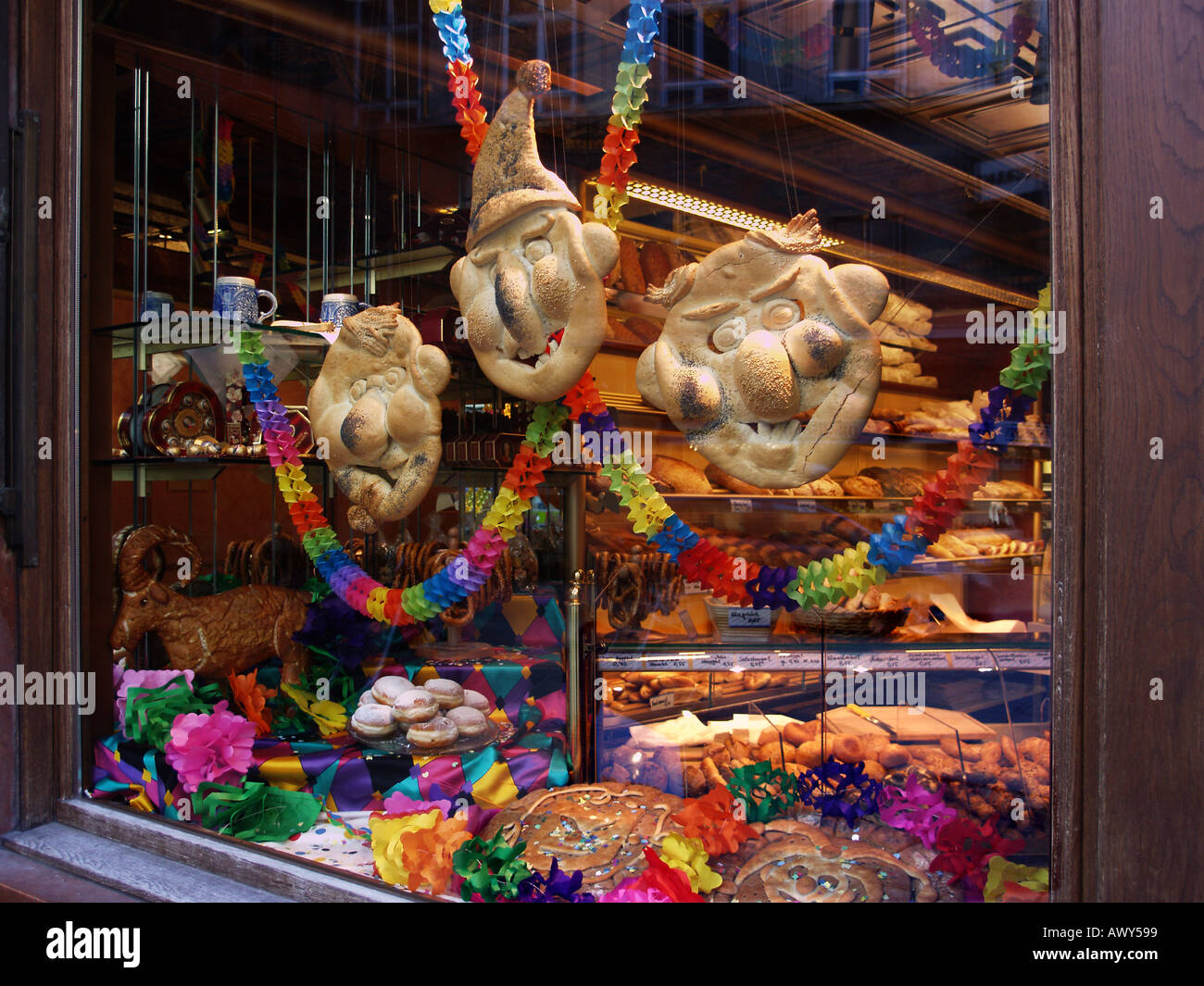 The window of a bakers shop in Salzburg Austria with grotesque masks of puppet characters made of bread Stock Photo