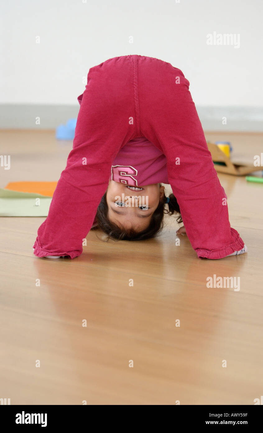 Toddler looking through legs Stock Photo Alamy