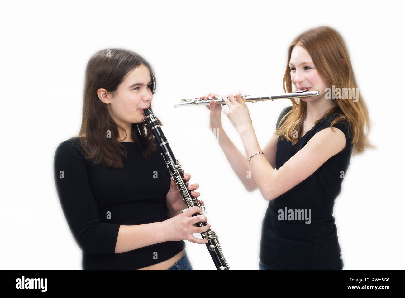 Teeenaged Girls Playing Flute and Clarinet Stock Photo