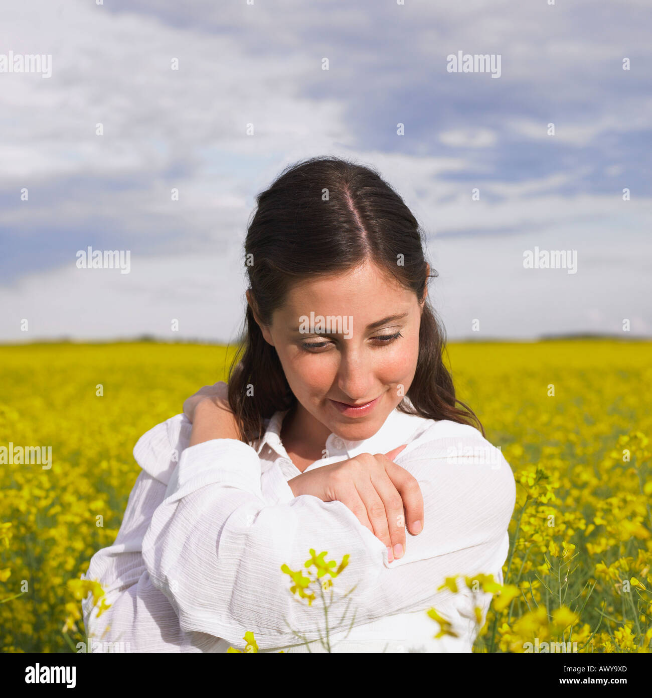 Young woman standing flower field sky day hi-res stock photography and ...