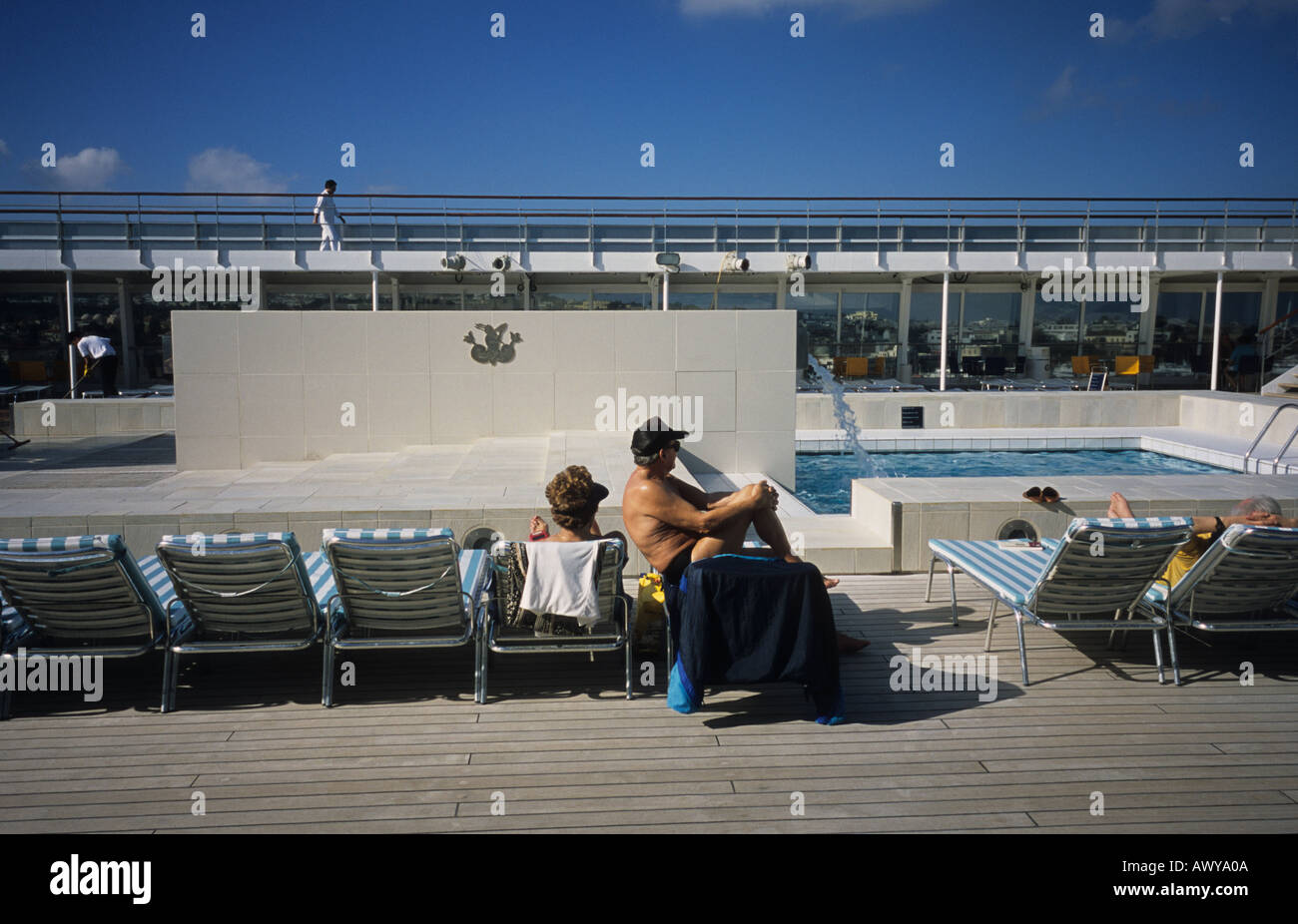 people relaxing on the swimming pool deck of a cruise ship Costa Stock Photo