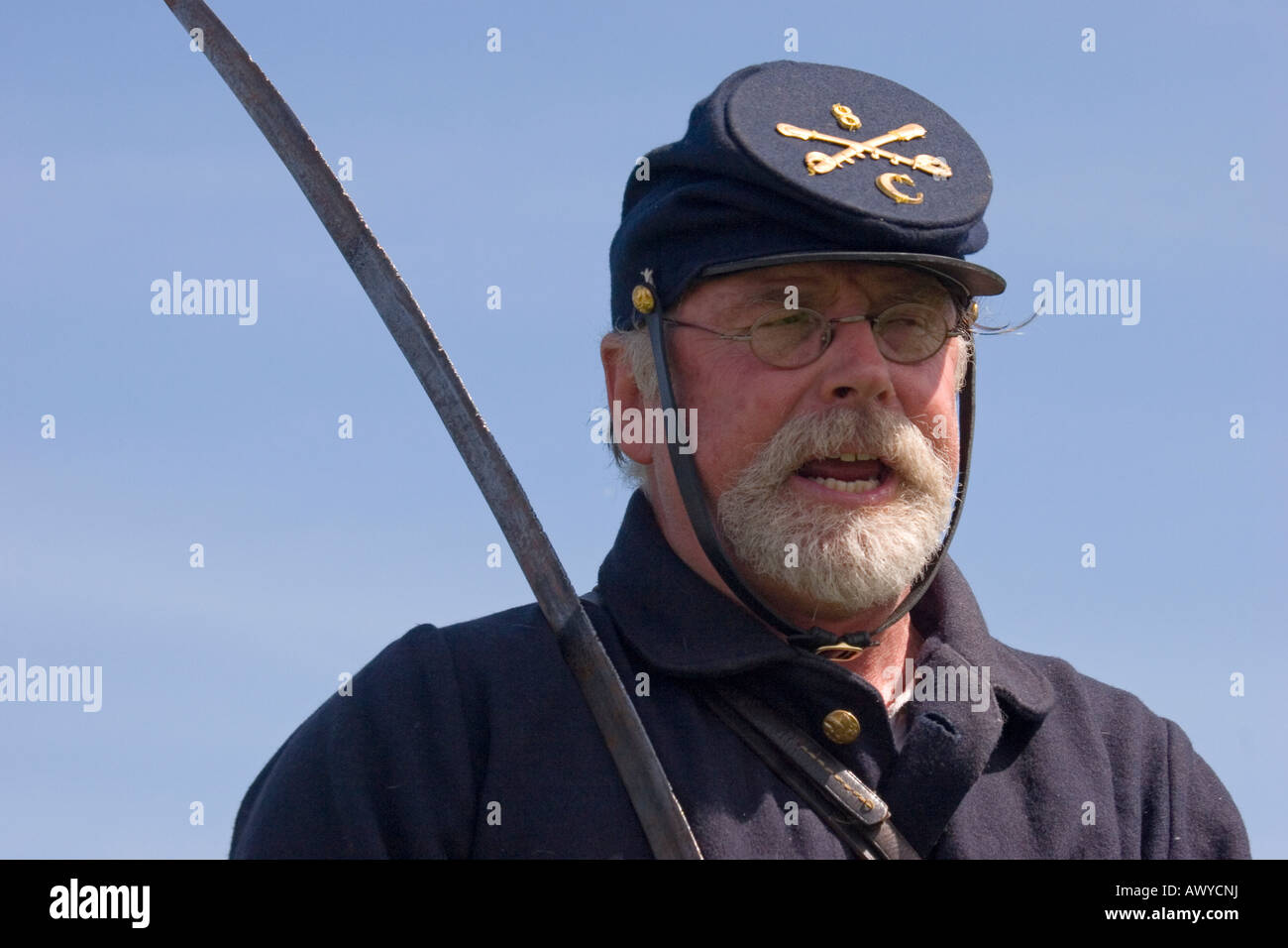 An actor dressed in an authentic uniform of the Union Army in the American Civil War, holding a saber. Stock Photo