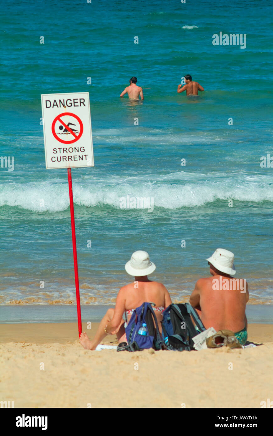 Sunbathers and swimmers Manly ocean beach Sydney Australia Stock Photo