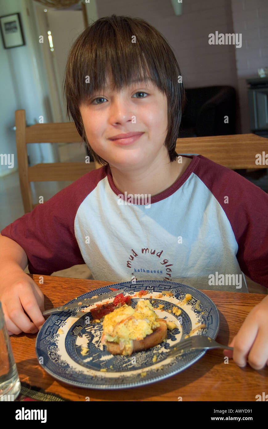 a-12-year-old-boy-eating-breakfast-stock-photo-alamy