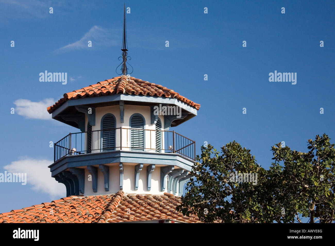 A cupola sits atop a terra cotta tiled roof, typical of the Spanish