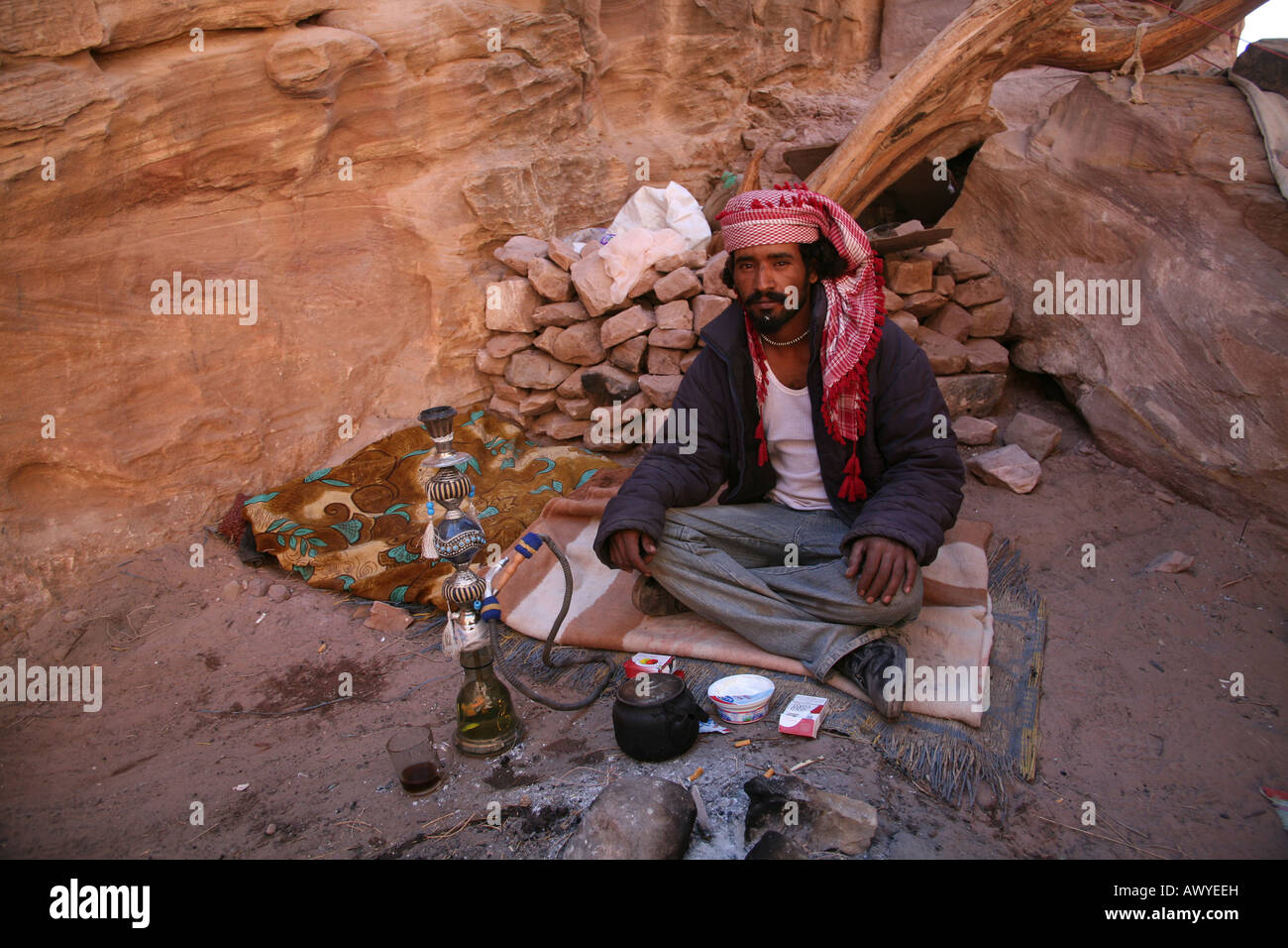 A portrait of a man in Petra an ancient city in the southwest of Jordan It was hewn from towering walls of rock Its buildings we Stock Photo
