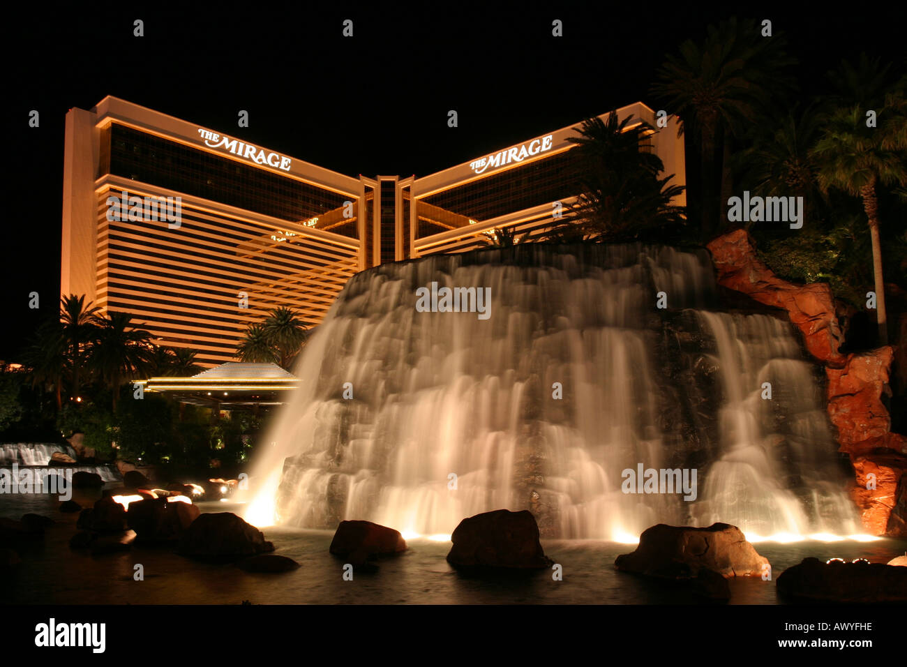 The Mirage Hotel illuminated at night, with towering waterfalls, Las Vegas, Arizona, USA Stock Photo