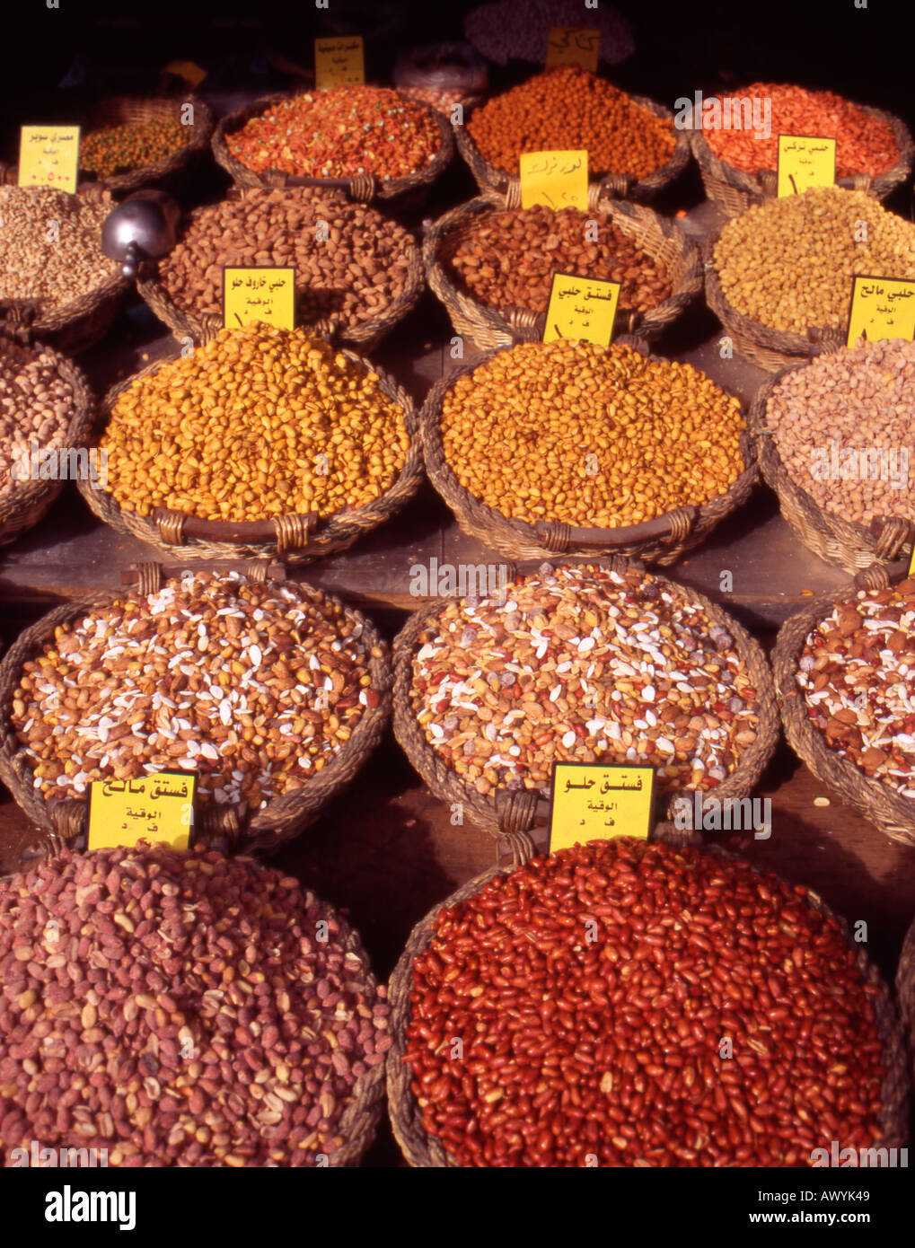 Baskets of nuts spices cereal and lentils in a shop in downtown Amman Jordan The Middle East Stock Photo