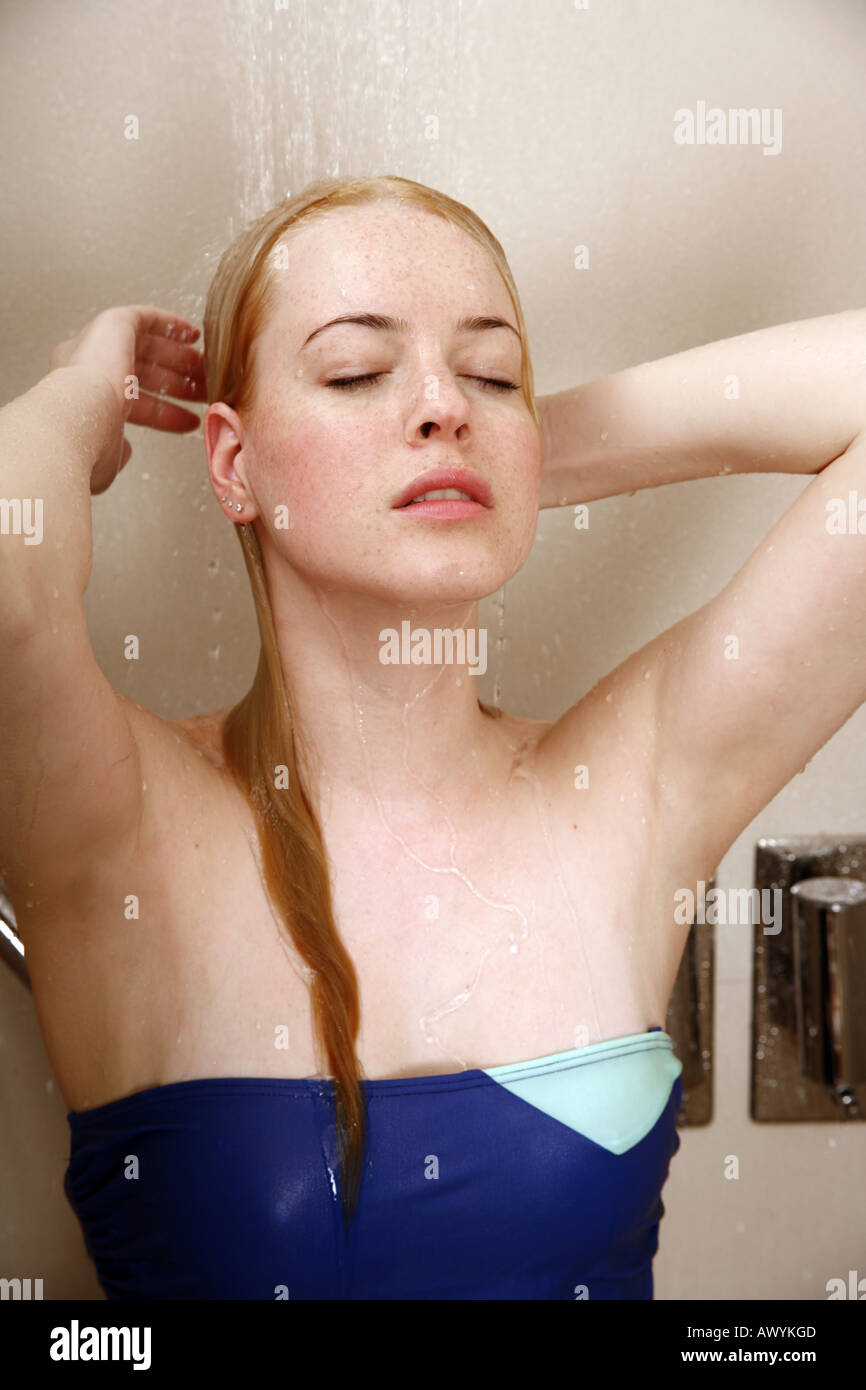 Woman taking a shower at the gym Stock Photo Alamy