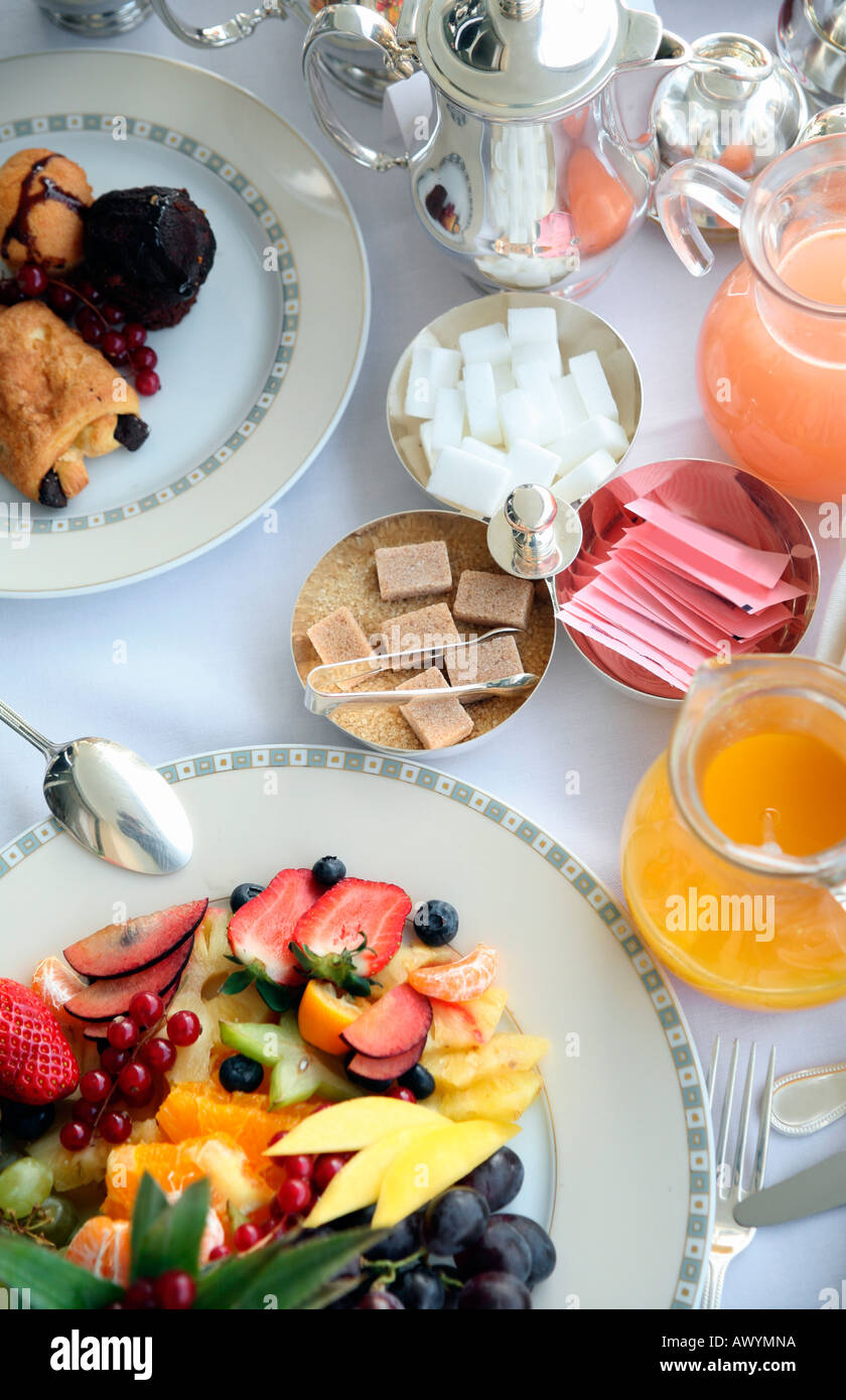 Breakfast table with fruit pastries juices Stock Photo Alamy