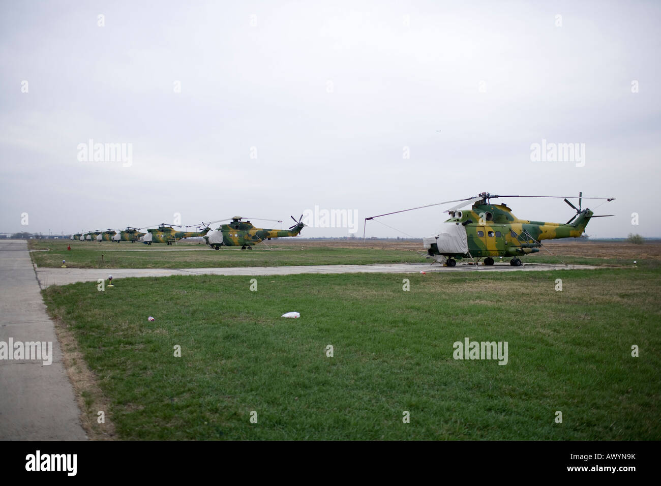 military helicopters parked near the runway Stock Photo