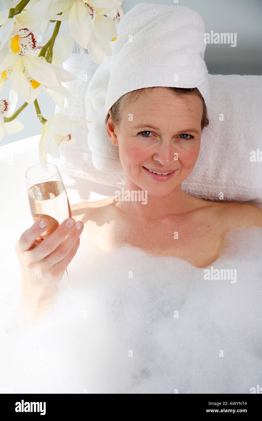 Mature woman enjoying bubble bath Stock Photo - Alamy