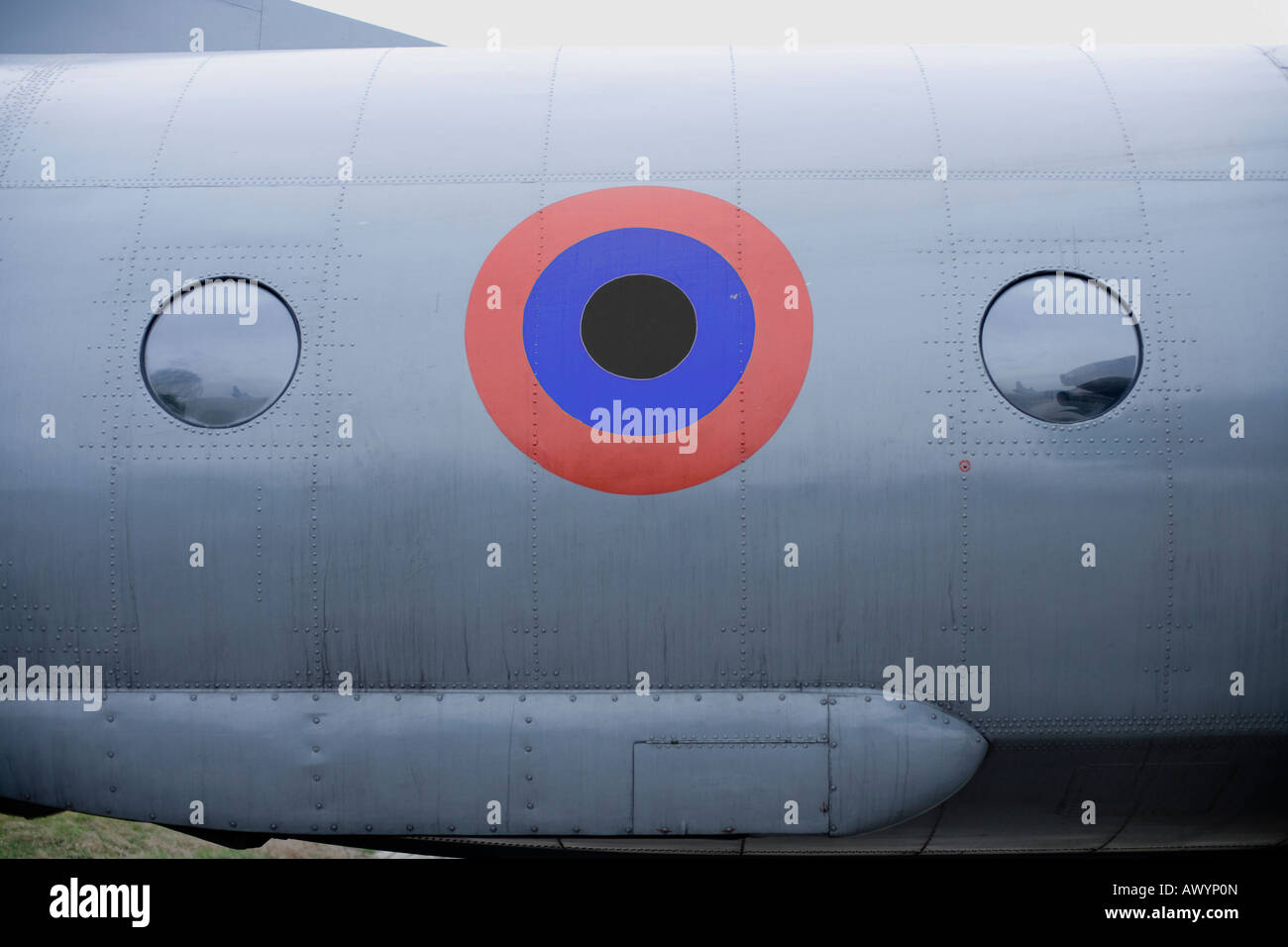 red blue and black concentric circles on the fuselage of an military airplane Stock Photo