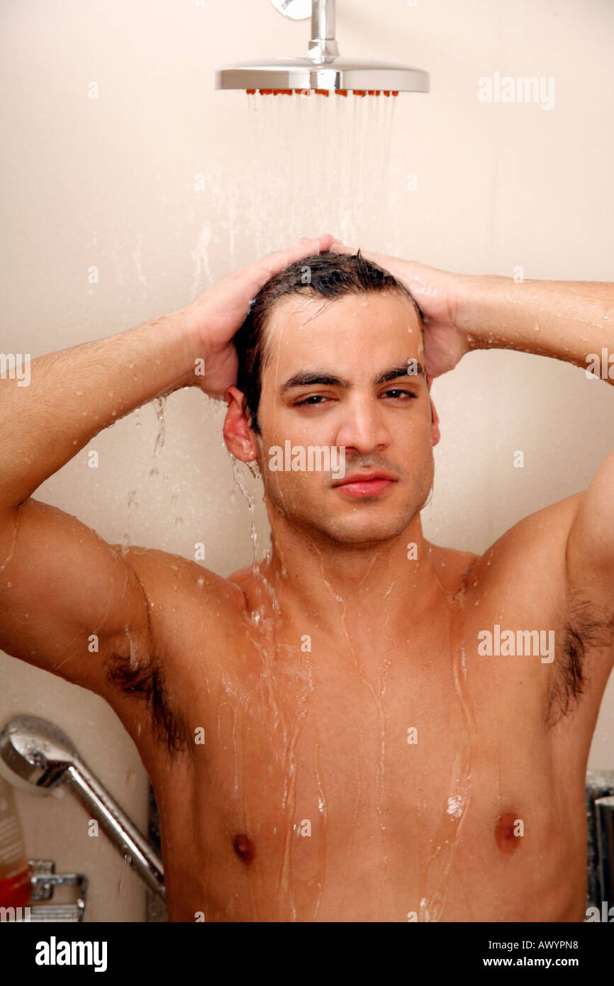 Man taking a shower at the gym Stock Photo Alamy