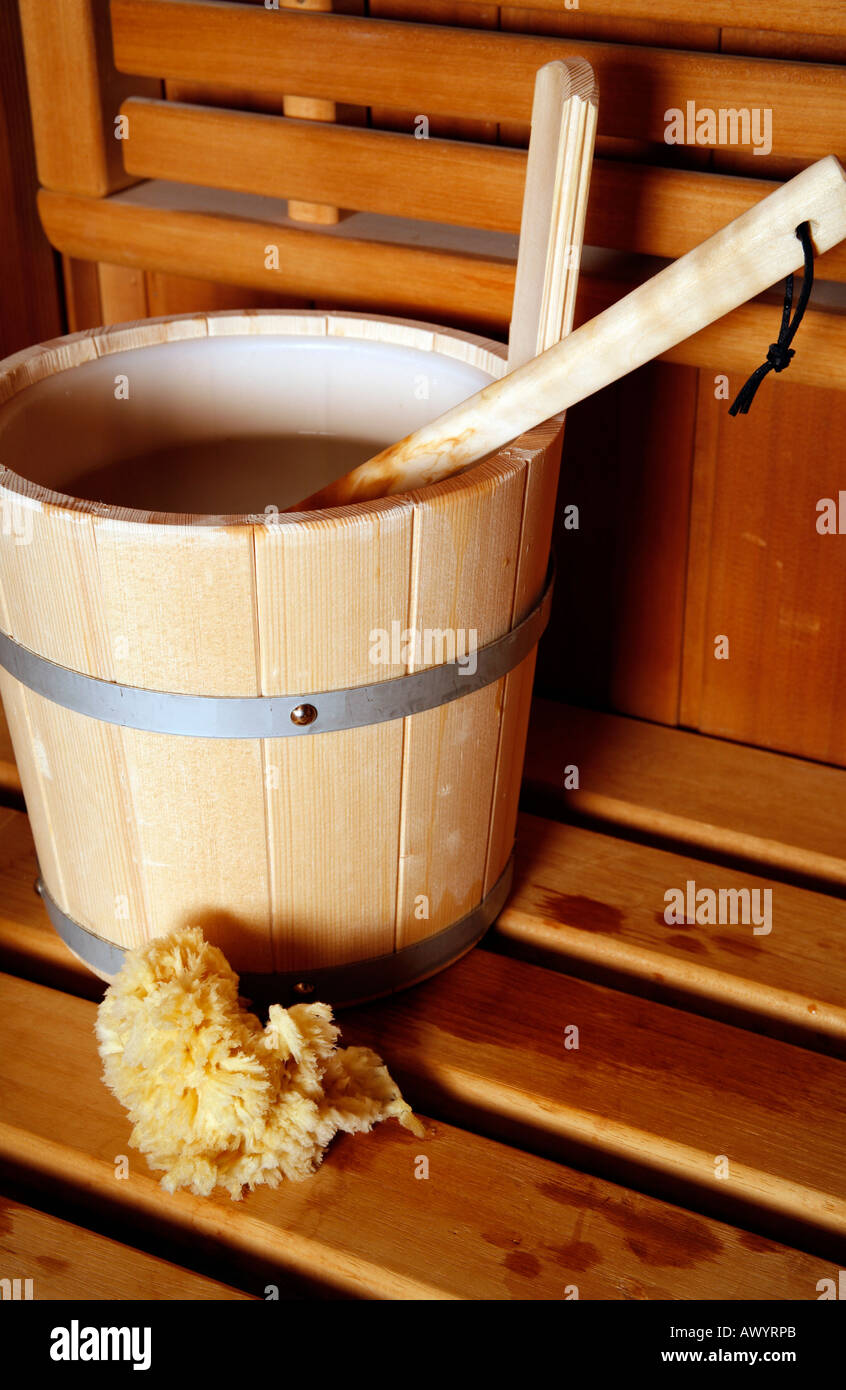 Water bucket with ladle in a sauna Stock Photo Alamy