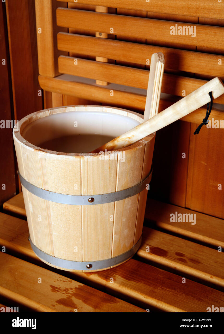 Water bucket with ladle in a sauna Stock Photo Alamy