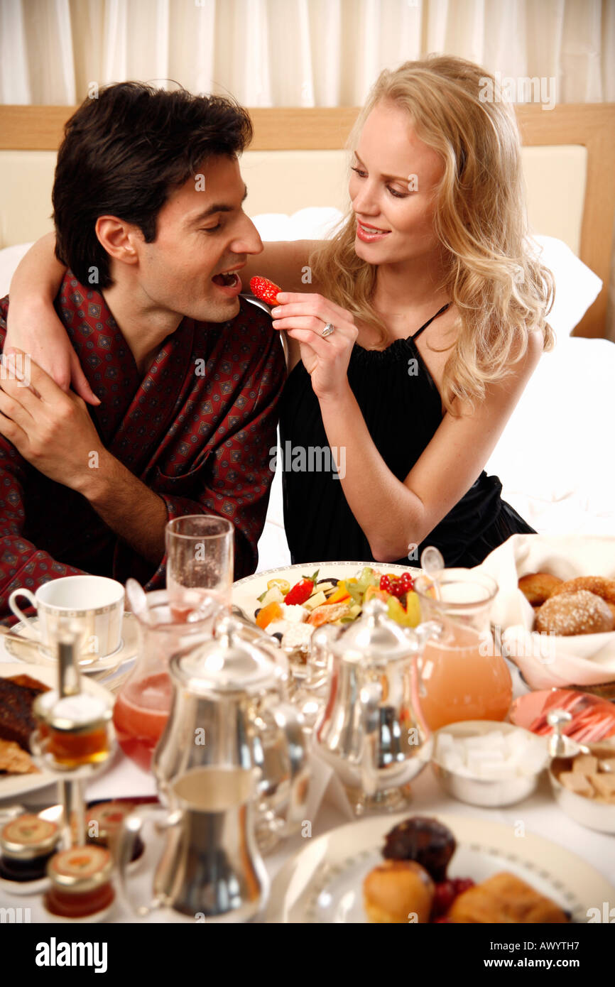 Couple having breakfast in hotel room Stock Photo