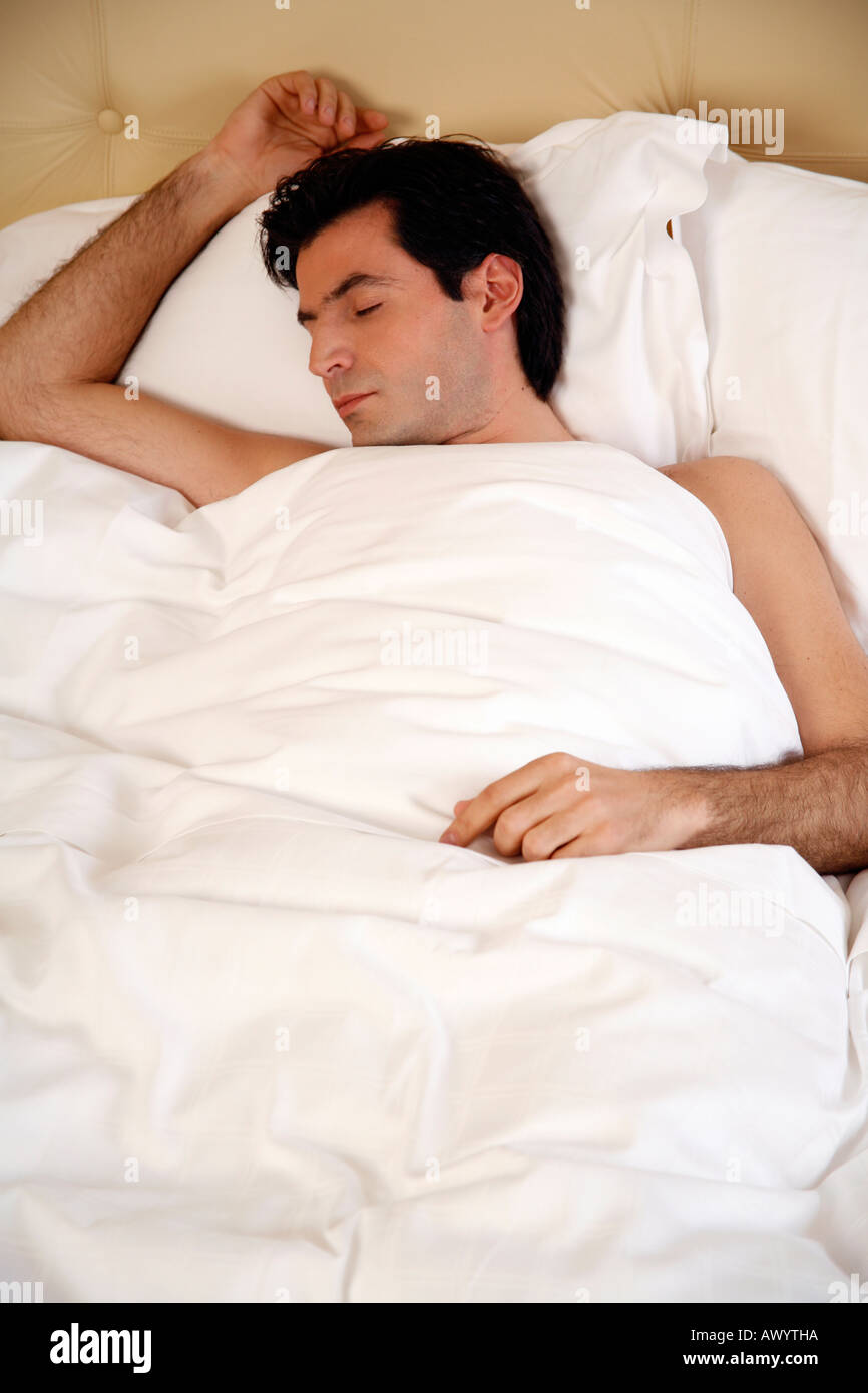 Man sleeping in cot in hi-res stock photography and images - Alamy