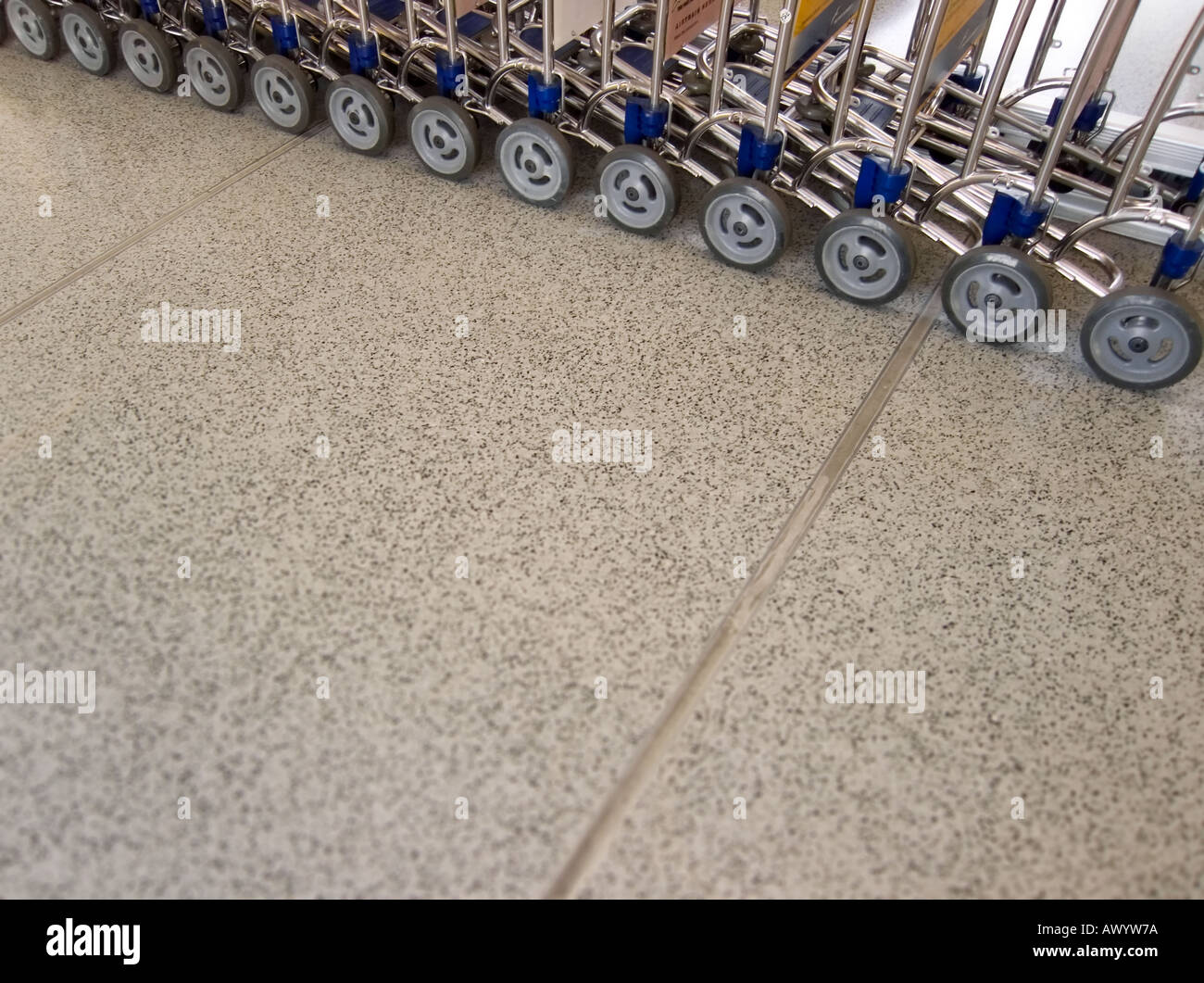Section of airport trolleys on tiled floor Newark airport New Jersey