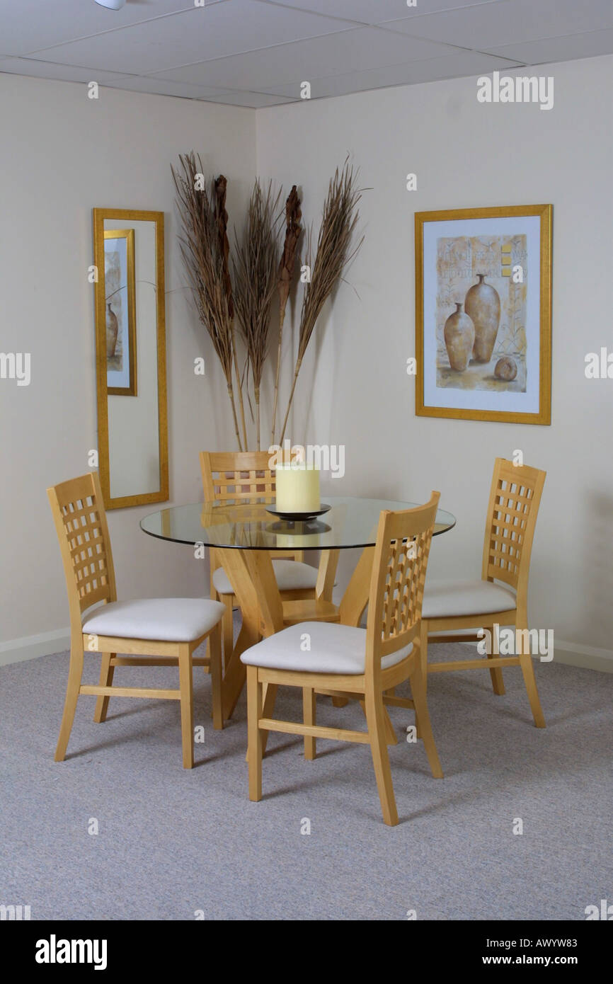 Dining room Glass table and chairs in setting Stock Photo - Alamy