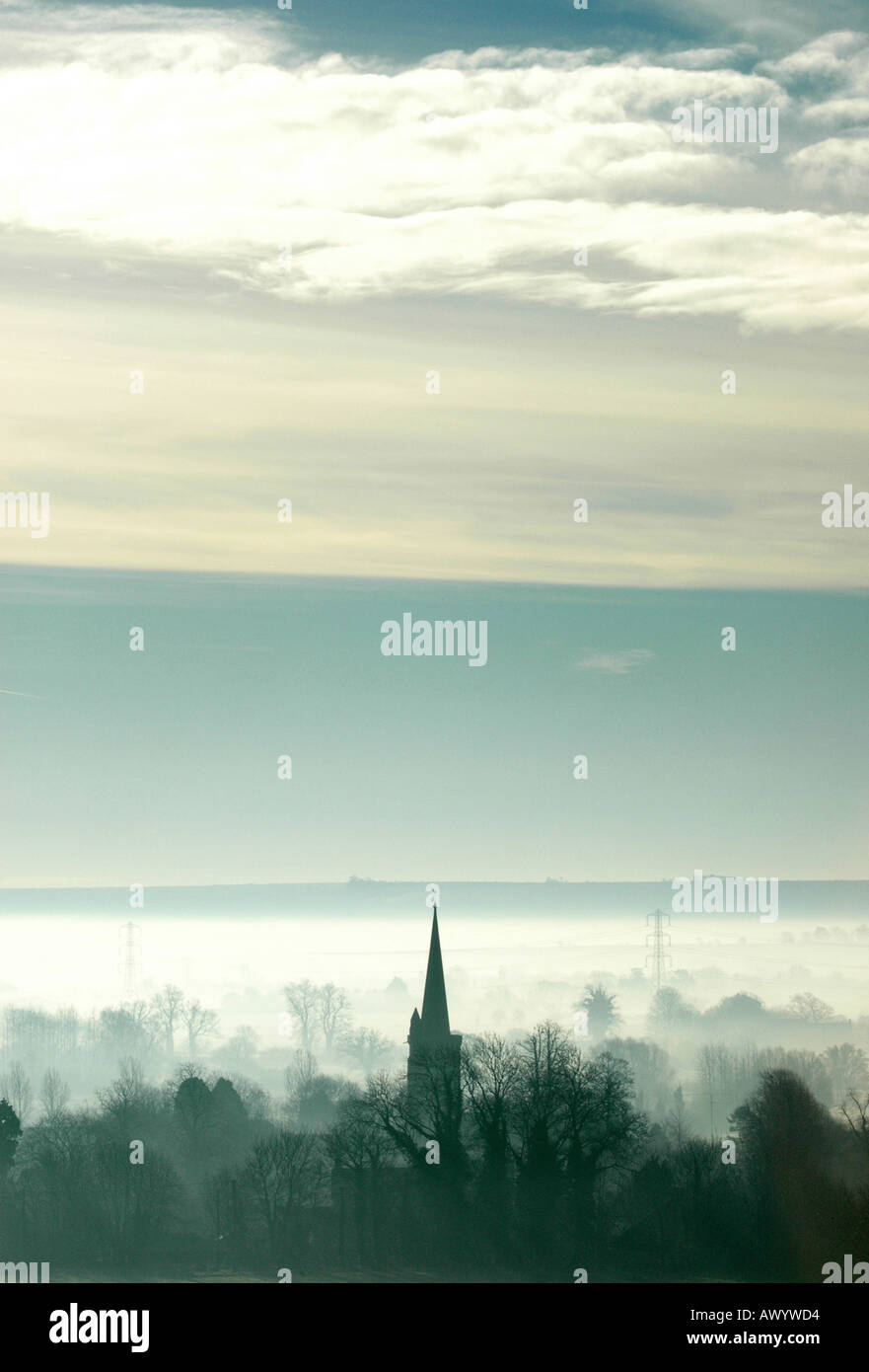 Church spire through mist on an early September morning,