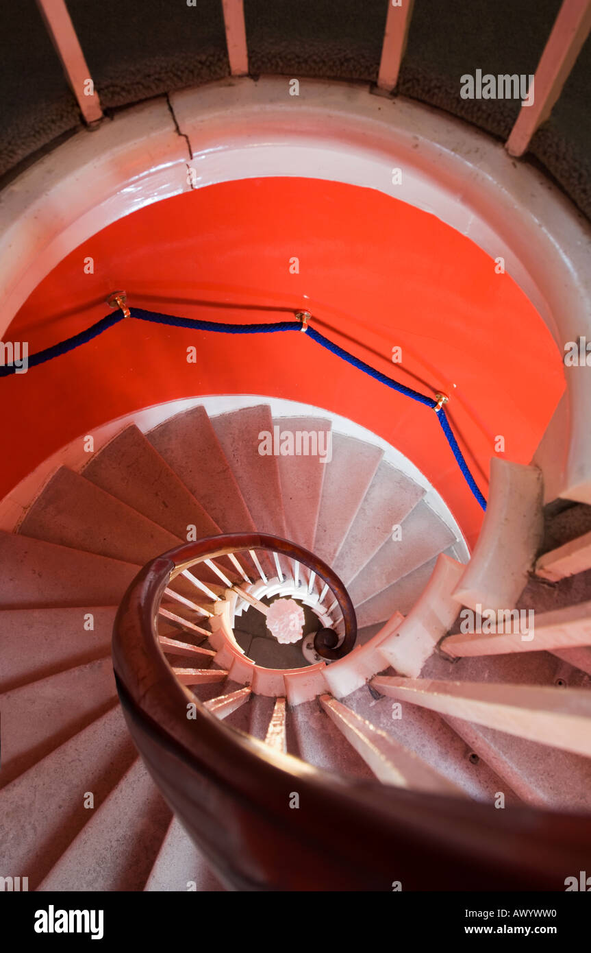 A view down the spiral stairs of the Red Staircase at Plas Newydd on the Isle of Anglesey Wales Stock Photo