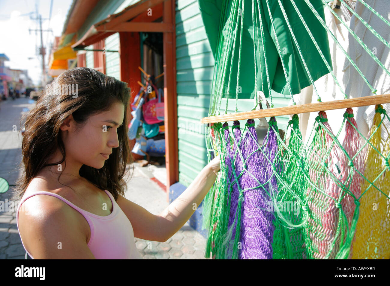 Young woman shopping hammock, souvenir shop, Isla Mujeres, Cancun, Mexico. MR-03-05-2008 Stock Photo