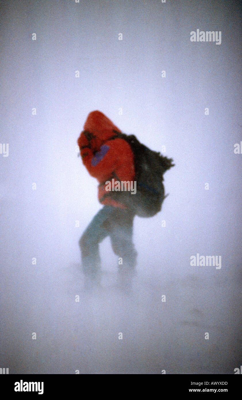 Mountaineering in a snow blizzard during winter in Glen Coe Highlands Scotland United Kingdom of Great Britain Stock Photo