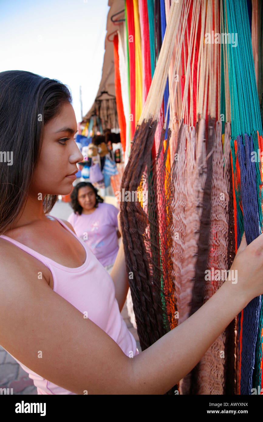 Young woman shopping hammock, souvenir shop, Isla Mujeres, Cancun, Mexico. MR-03-05-2008 Stock Photo