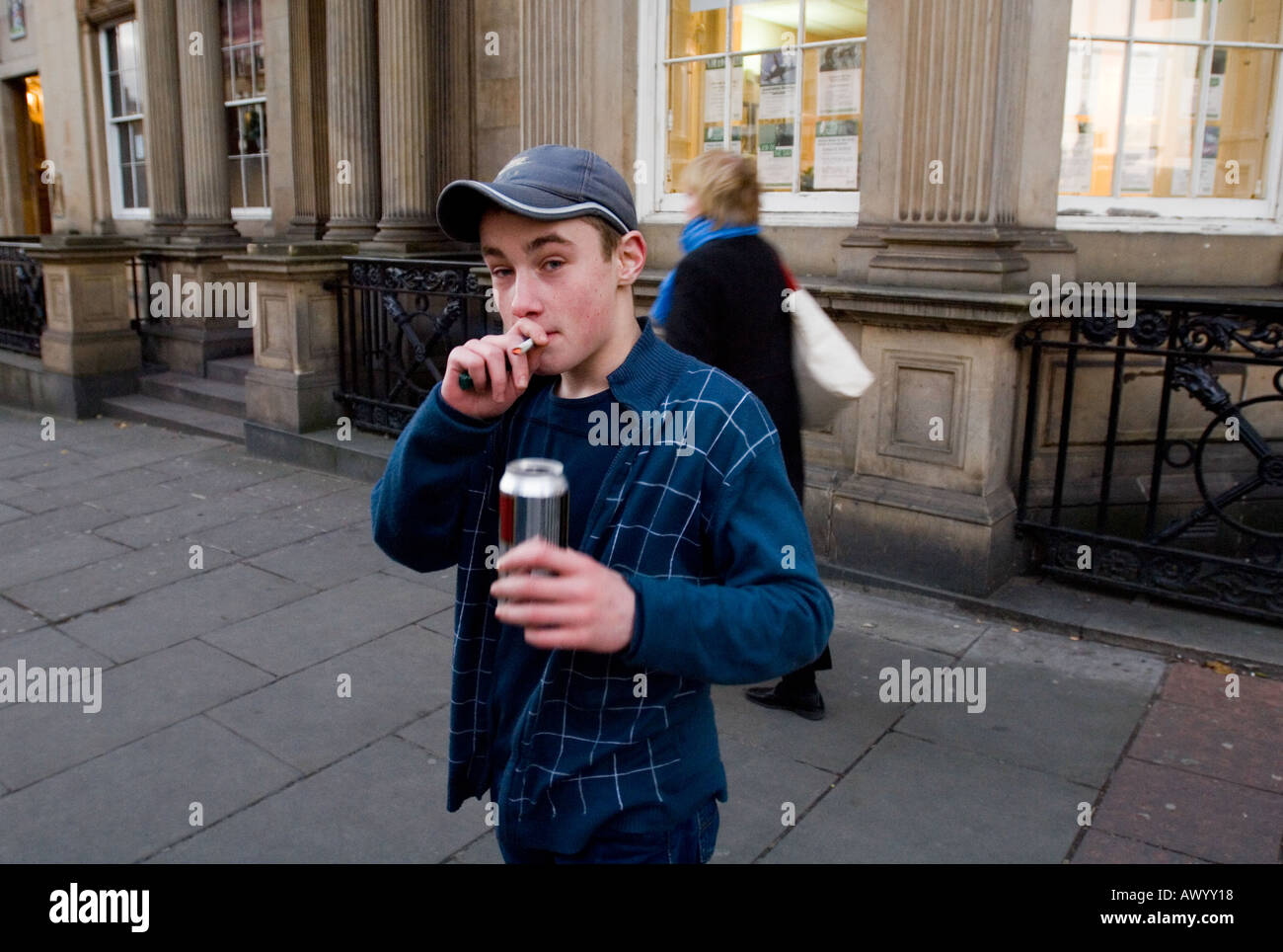 Youth drinking beer and smoking in city centre Stock Photo - Alamy