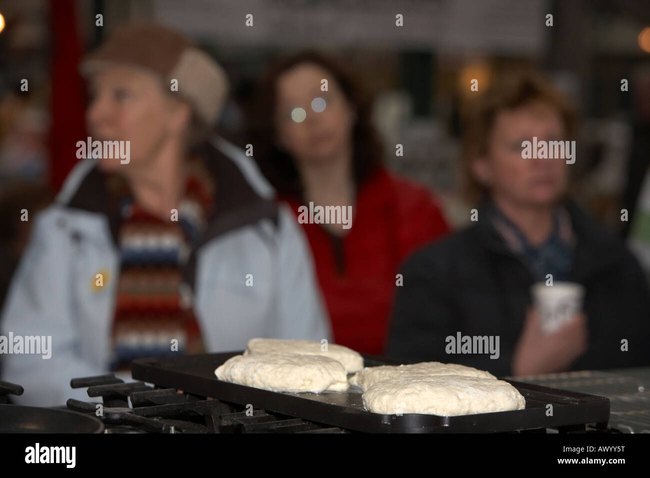traditional irish soda bread cooking on a flat pan griddle in front of