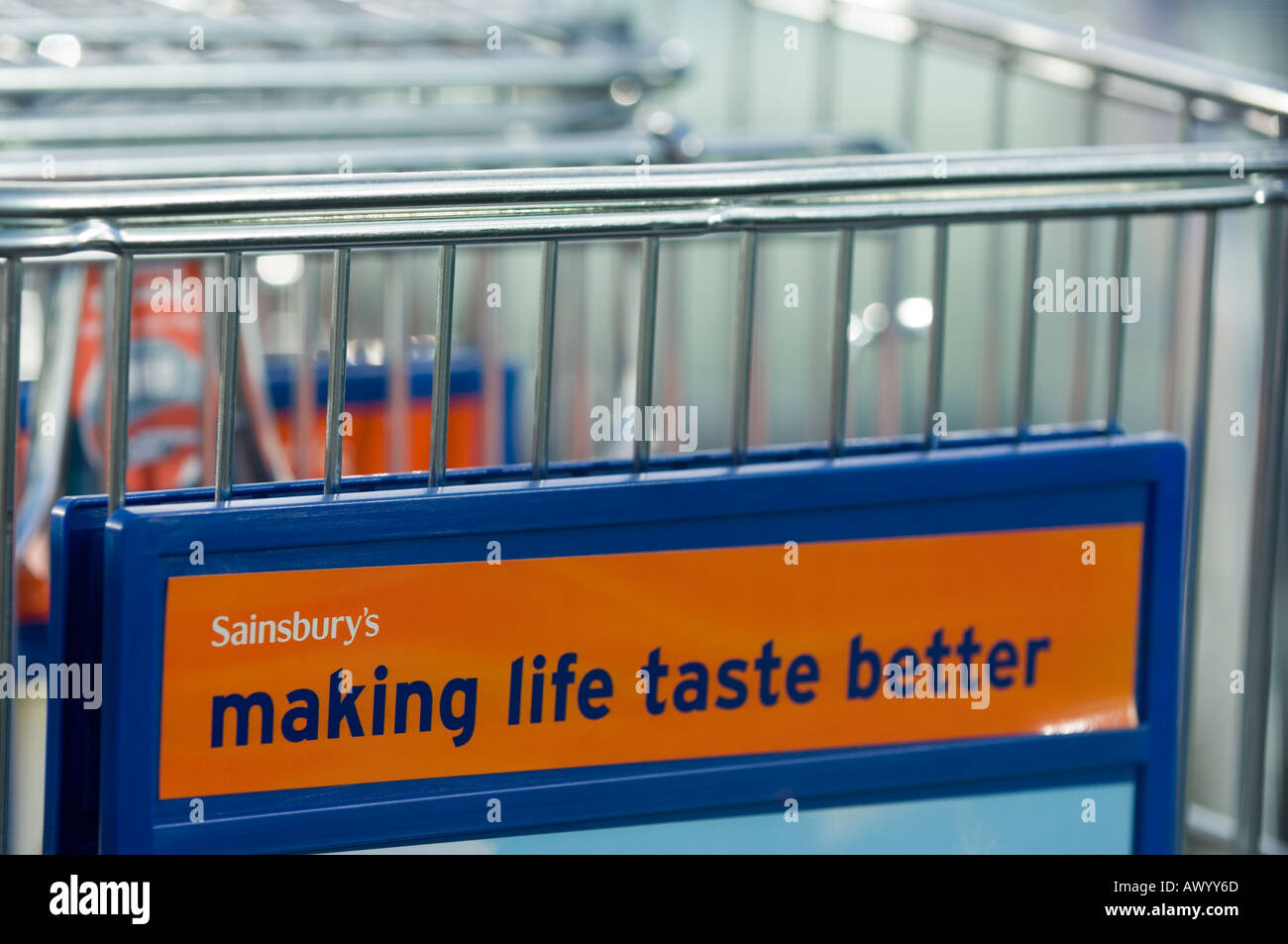 Sainsbury's supermarket  trolleys and advertising slogan 'making life taste better' Stock Photo