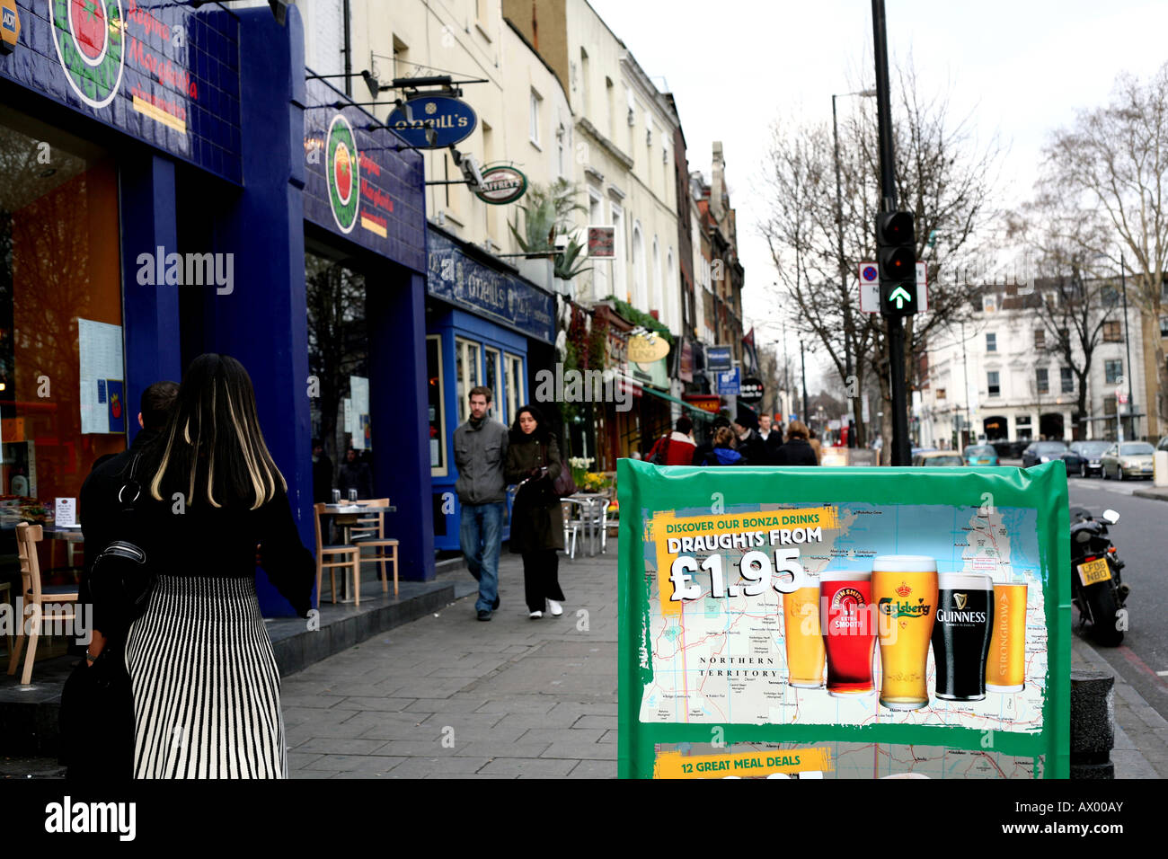 Cheap beer offer on board outside London pub 2008 Stock Photo