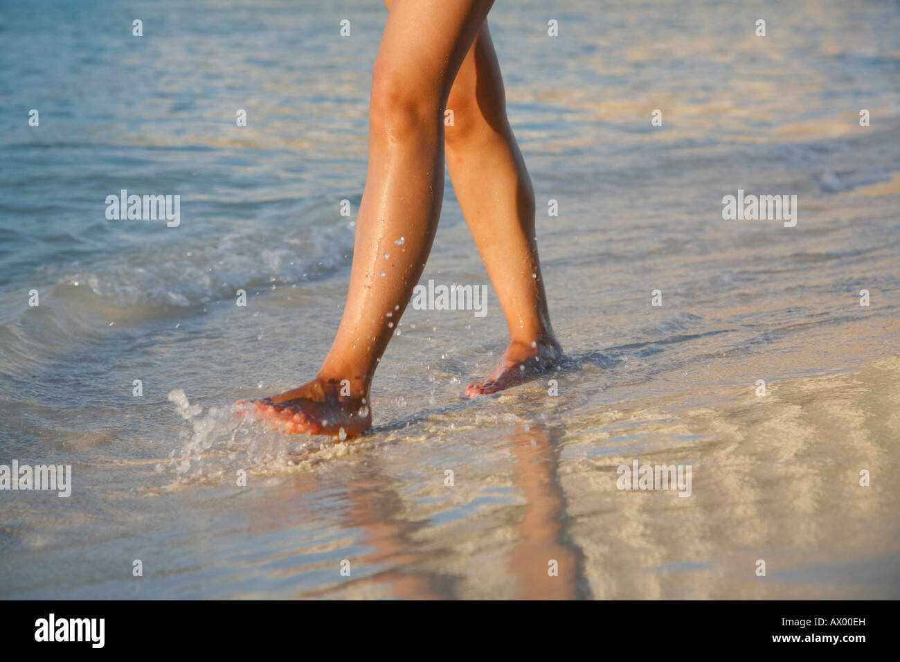 Woman walking barefoot street hi-res stock photography and images - Alamy