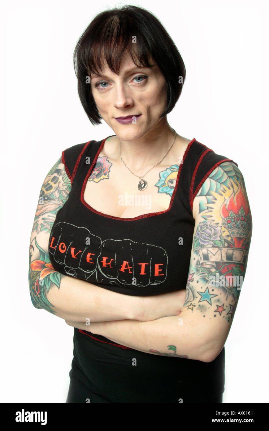 Heavily tattooed female wearing a 'Love, Hate' t-shirt. Stock Photo