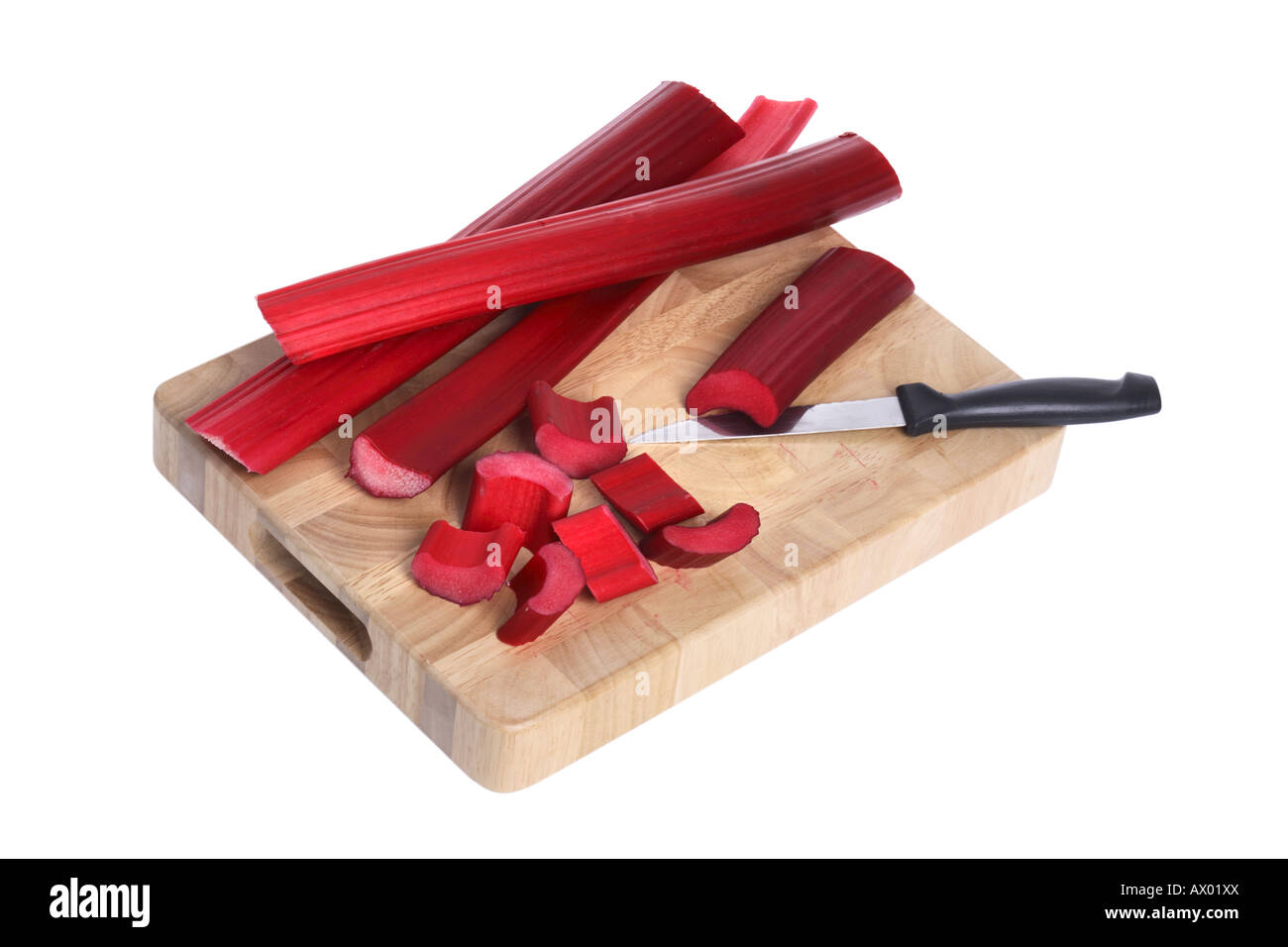Cutting board with rhubarb cut out on white background Stock Photo