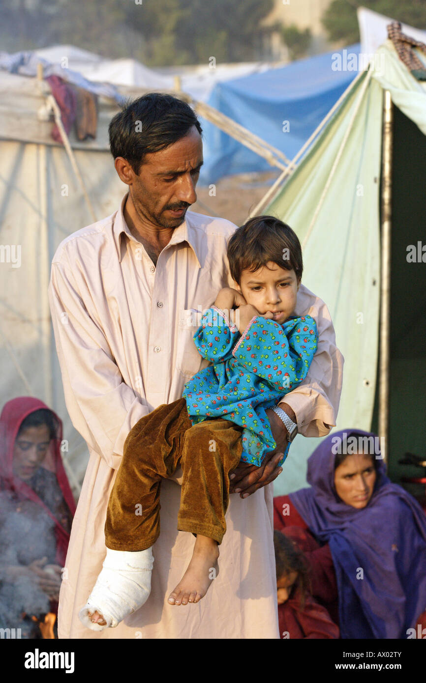 Man and his son in the earthquake area in Pakistan Stock Photo