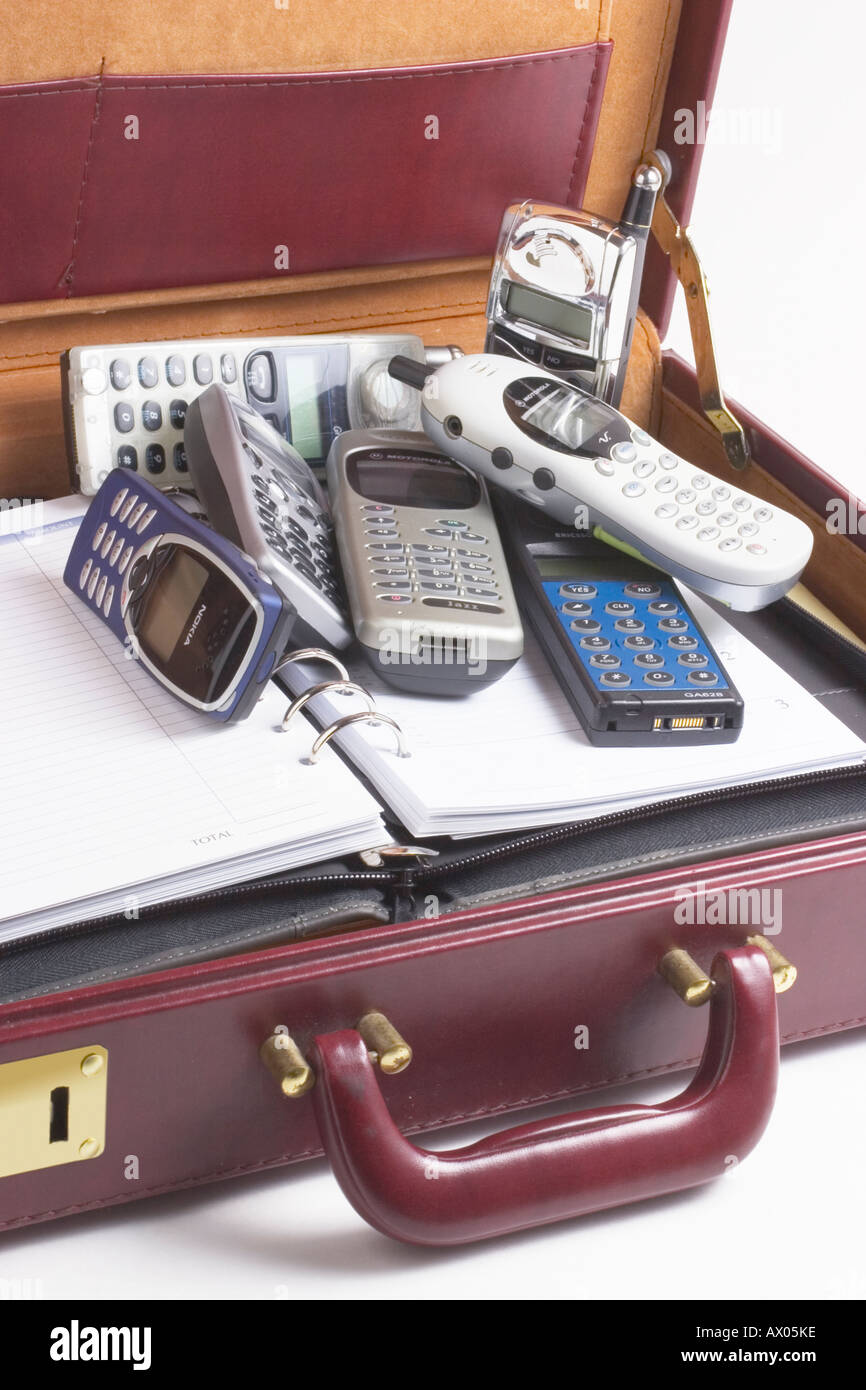 Briefcase with Assorted Mobile Phones Stock Photo Alamy